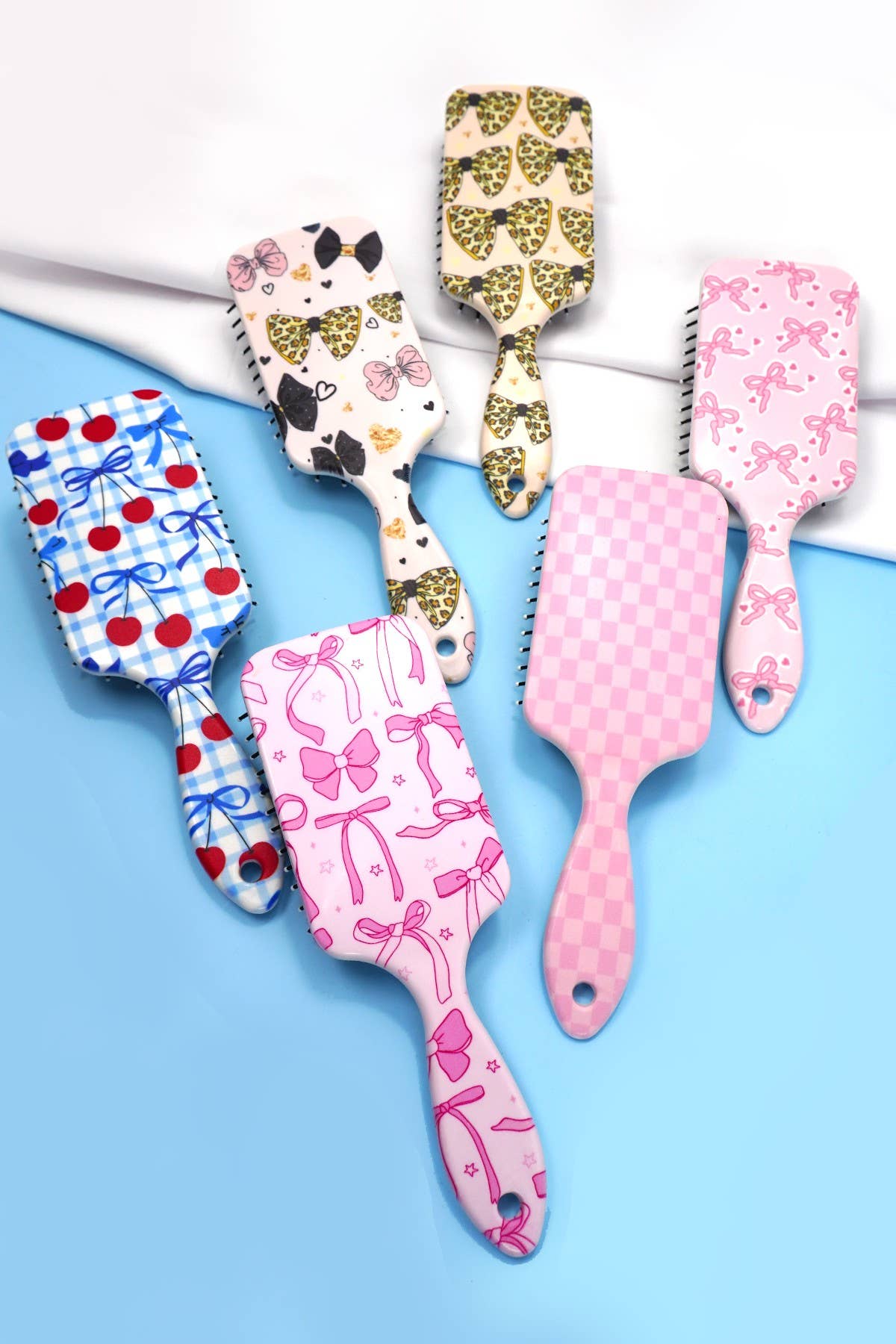 JOSSLYN by wall to wall - LARGE DETANGLE PADDLE HAIR BRUSH COMB | 40HC100: BOW B